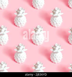 White pineapple tropical fruit repeat seamless pattern on light pastel pink background for wrapping paper. Stock Photo