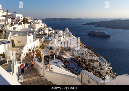 Santorini, Greece - July 10, 2021: Walking in the streets of Santorini in Greece. Stock Photo