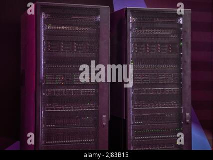A close-up photo of two black server racks Stock Photo