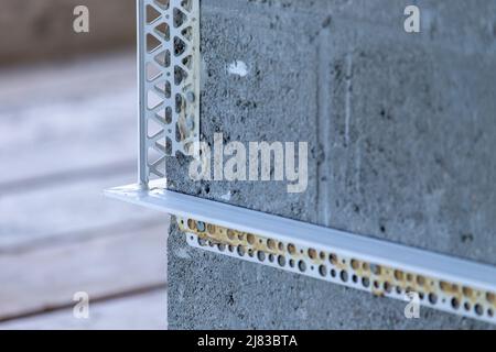 Corner of building under construction showing Cinder Concrete Blocks with Corner Beading on it for Stucco installation Stock Photo