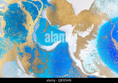 Alcohol-based ink texture in blue tones with gold. Copy space. Stock Photo