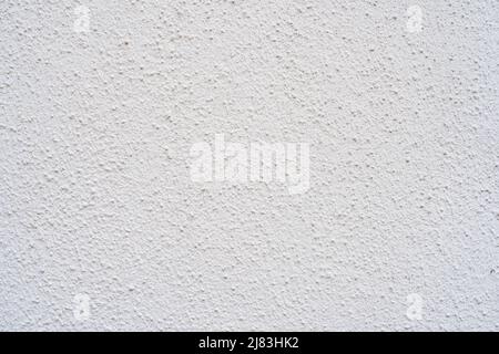 Rough white plaster of a house wall with a medium coarse structure Stock Photo