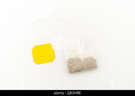 With white background isolated tea bag with blank label. Stock Photo