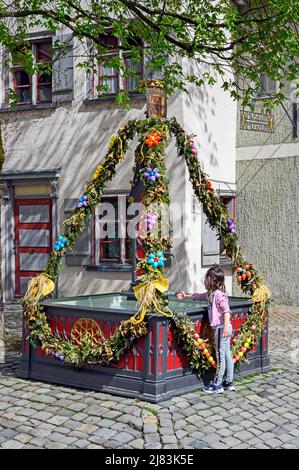 Easter decorated fountain at the city wall, Wangen im Allgaeu, Baden-Wuerttemberg, Germany Stock Photo