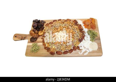A Collection of Healthy Nuts and Seeds on a Board. Stock Photo