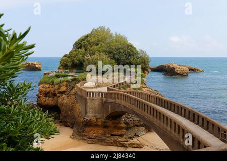 Bridge to the Rocher du Basta rock on the beach in Biarritz, France. Stock Photo