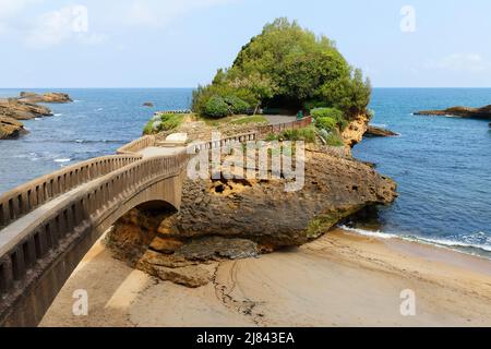 Bridge to the Rocher du Basta rock on the beach in Biarritz, France. Stock Photo