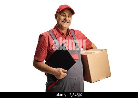 Delivery man holding a cardboard box and a clipboard isolated on white background Stock Photo