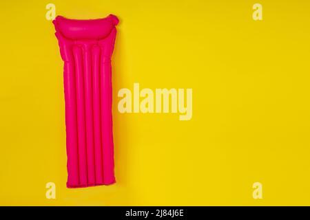 pink mattresses in studio yellow background mock-up copespase Stock Photo