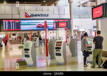 Brisbane Australia,Airport BNE domestic terminal,self-service kiosks kiosk Qantas airline airlines,carrier,logo ticketing man woman couple travelers Stock Photo