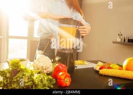 redhaired ginger pregnant woman shake smoothies fruit in blended.eco friendly lifestyle:useing reusable tube Stock Photo