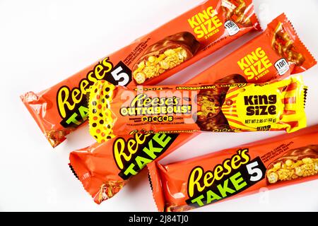Reeses milk chocolate bar with candy pieces and caramel isolated on a white background. Stock Photo