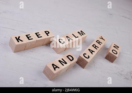 wooden blocks building the word KEEP CALM AND CARRY ON Stock Photo