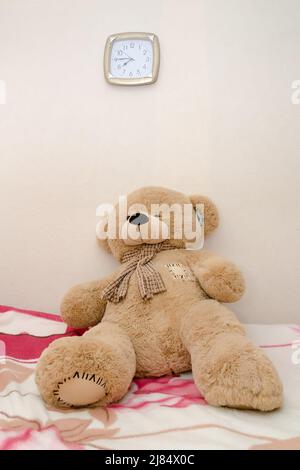 brown teddy bear sits on the window alone, children's toy Stock Photo ...