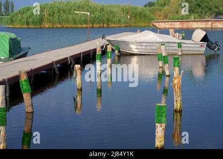 Motor boats moored at the pier Stock Photo
