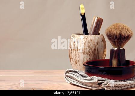 Bathroom wooden table with men's shaving tools, razor, brush, toothbrush. Banner with copy space Stock Photo