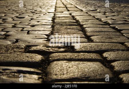 low angle shot of cobblestone street with very shallow depth of field Stock Photo