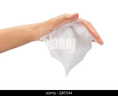 Female hand with soap bubbles on white background. Hands with white bubbles. Texture of white soap foam on female hand. Stock Photo