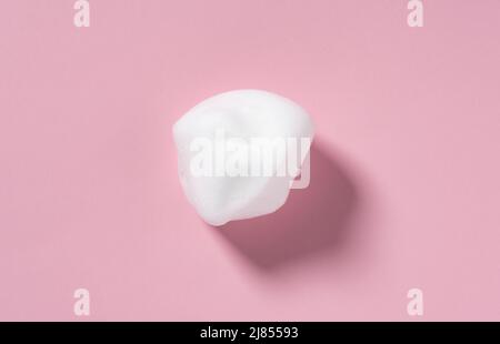 Skincare cleanser foam texture. Swatches of soap, shampoo and cleansing mousse foam with copy space on pink background. Close-up of facial cleansing s Stock Photo