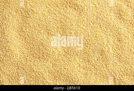 Uncooked cous cous background Stock Photo
