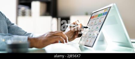 Kanban Project Management Software On Laptop. Digital Calendar Schedule Stock Photo