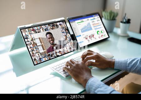 Watching Video Conference Business Webinar On Computer Stock Photo