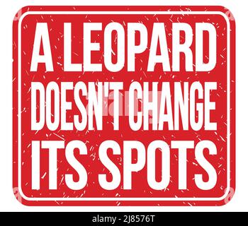 A LEOPARD DOESN'T CHANGE ITS SPOTS, text written on red stamp sign Stock Photo