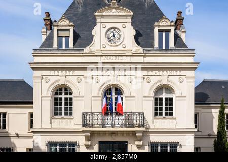Facade of a french city hall with the national motto of France 'Liberty, Equality, Fraternity' engraved and the french and european flags. Stock Photo