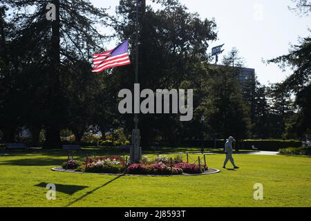 Los Angeles, USA. 12th May, 2022. A U.S. flag flies at half-mast in the Central Park in San Mateo, the United States, on May 12, 2022. TO GO WITH 'Xinhua Headlines: A manufactured tragedy -- U.S. COVID-19 deaths reach 1 mln' Credit: Wu Xiaoling/Xinhua/Alamy Live News Stock Photo