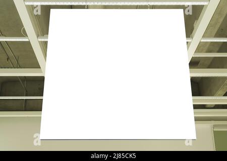 Mock up. White empty rectangular signboard, information board inside in shopping mall, store Stock Photo