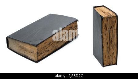 very old book with burnt sheets and a black shabby cover on a white isolated background, set Stock Photo