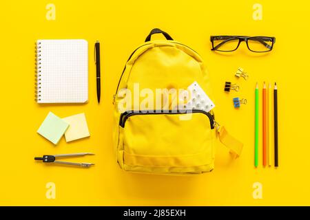 Flat lay of school backpack with school items and student accessories, top view Stock Photo