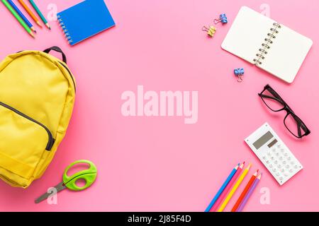 School backpack with school items and students equipment, top view Stock Photo
