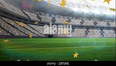 Image of stars over rugby balls falling with france text at stadium Stock Photo