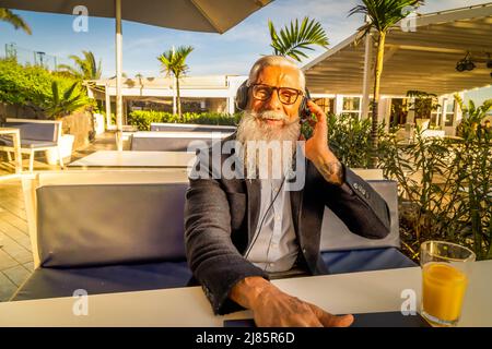Senior man working with laptop Stock Photo