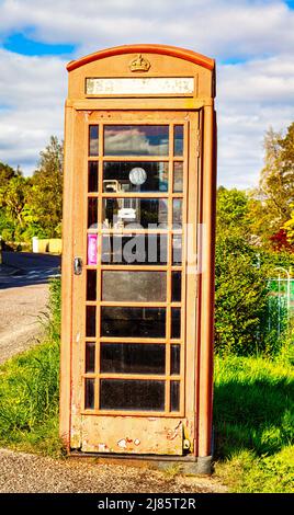 Traditional British red public  telephone box  in the  Highland village of Plockton, Scotland Stock Photo