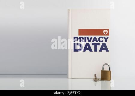 Privacy data protection concept, a lock in front of a book with the text: Privacy Data on its cover Stock Photo