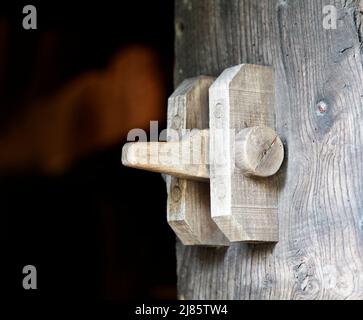 Old traditional wooden door latch Stock Photo