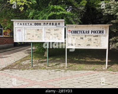 Moscow. Russia. May 6, 2022. Photo of the stand with the Russian newspapers Pravda and Soviet Russia. Newspapers on the stand for public reading. Stock Photo