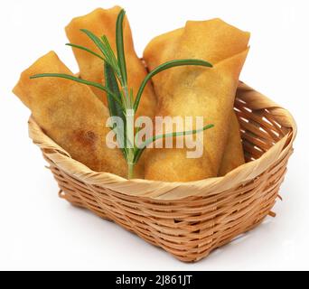 Vegetables rolls with rosemary over white background Stock Photo