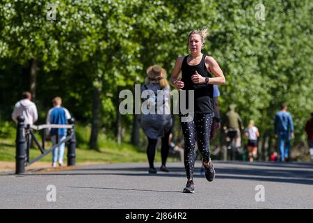 London, UK. 8th May, 2022. A woman seen jogging on a warm and sunny day in London. According to the Met Office, a warmer temperature is forecast in London for the coming days. (Credit Image: © Dinendra Haria/SOPA Images via ZUMA Press Wire) Stock Photo