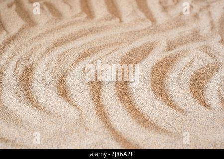 Wavy sea sand background. Flat lay. Copy space Stock Photo