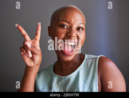 A young Black model poses with peace sign Stock Photo