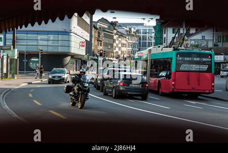 Biel, Switzerland - Mai 11, 2022: View of city life, traffic on the main road in Biel. Biel-Bienne is an industrial bilingual german-french town in Sw Stock Photo