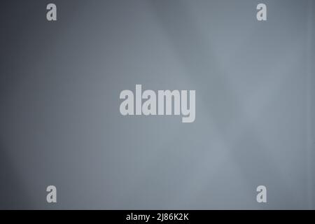Gray background with dark stripes. Mysterious gray background with diagonal lines. Stock Photo