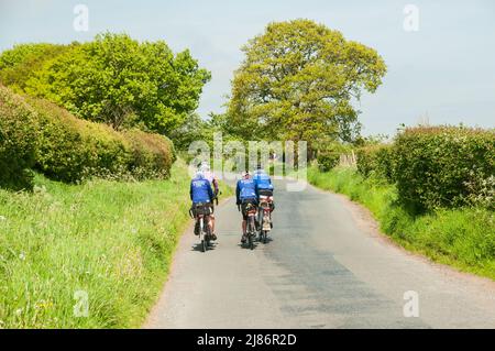 A group of cyclists enjoying the countryside on the outskirts of Chorley, Lancashire, UK Stock Photo