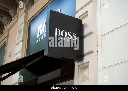 Barcelona, Spain - May 9, 2022: Hugo Boss store sign. Hugo Boss is a German luxury fashion house Stock Photo