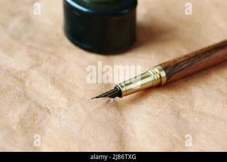 old empty paper and fountain pen on table  Stock Photo