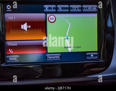 Reepham, Norfolk, UK – May 08 2022. Close up of the satellite navigation system in a 2018 Smart Car Stock Photo