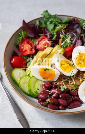 Medium boiled eggs with sasld, healthy breakfast Stock Photo